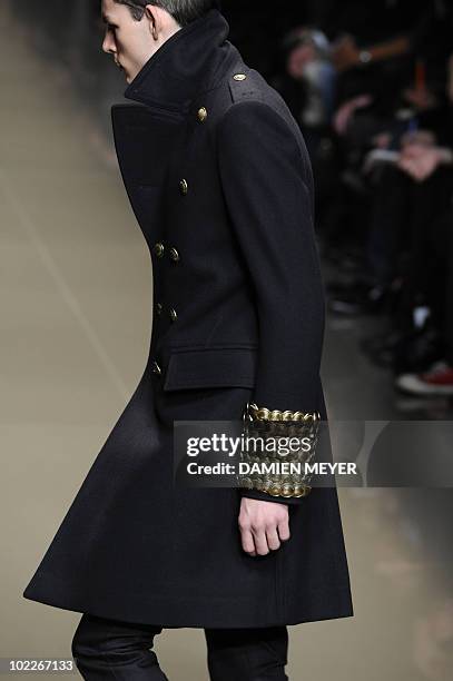 French model Tom Nicon displays a creation as part of Burberry Prorsum Fall-Winter 2010-2011 Menswear collection on January 16, 2010 during the Men's...