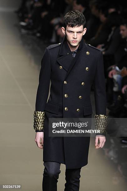 French model Tom Nicon displays a creation as part of Burberry Prorsum Fall-Winter 2010-2011 Menswear collection on January 16, 2010 during the Men's...