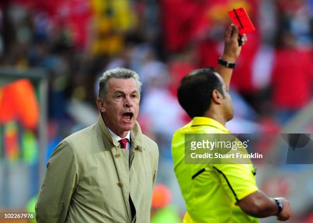 Ottmar Hitzfeld head coach of Switzerland shouts at Referee Khalil Al Ghamdi as he awards Valon Behrami of Switzerland a red card during the 2010...