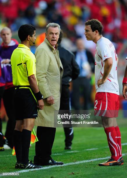 Head coach Ottmar Hitzfeld and Stephan Lichtsteiner of Switzerland appeal to the referee's assistant Hassan Kamranifar after referee Khalil Al Ghamdi...
