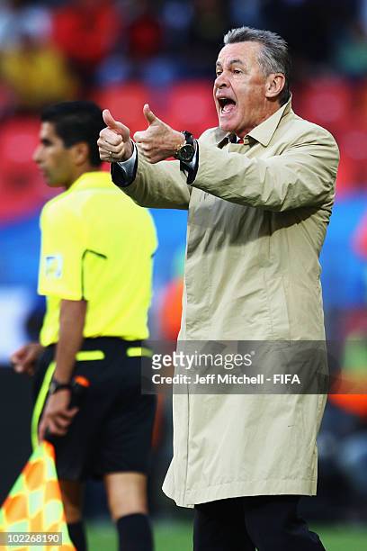 Ottmar Hitzfeld head coach of Switzerland gestures during the 2010 FIFA World Cup South Africa Group H match between Chile and Switzerland at Nelson...