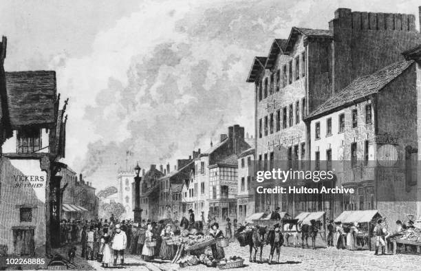 Traders and customers at the Old Market Place on Deansgate, Bolton, Lancashire, circa 1840. Engraves by Watkins from a drawing by Harwood.