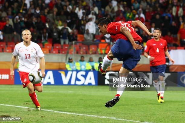 Mark Gonzalez of Chile scores the first goal during the 2010 FIFA World Cup South Africa Group H match between Chile and Switzerland at Nelson...