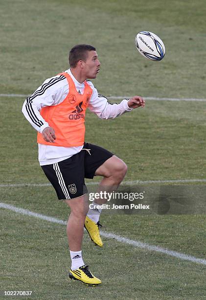 Lukas Podoslki of Germany plays rugby during a training session at Super stadium on June 21, 2010 in Pretoria, South Africa.