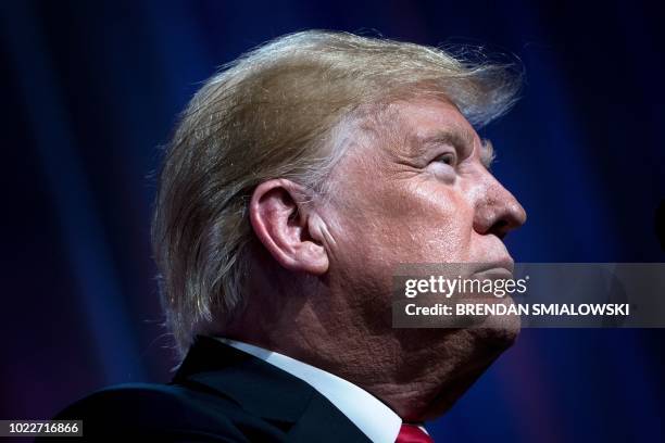 President Donald Trump pauses while speaking during the Ohio Republican Party State Dinner at the Greater Columbus Convention Center August 24, 2018...