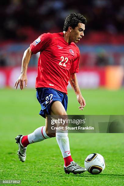 Esteban Paredes of Chile runs with the ball during the 2010 FIFA World Cup South Africa Group H match between Chile and Switzerland at Nelson Mandela...