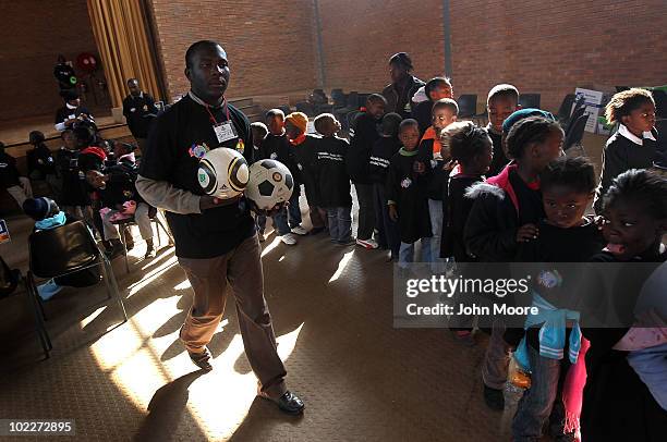 Disadvantaged youth go out for soccer training while at a camp run by the South African Business Coalition on HIV/AIDS on June 21, 2010 in Soweto,...