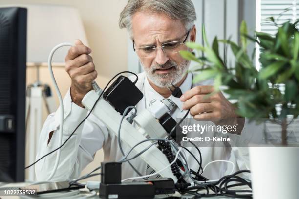 overcrowded power board - over loaded power strip stock pictures, royalty-free photos & images