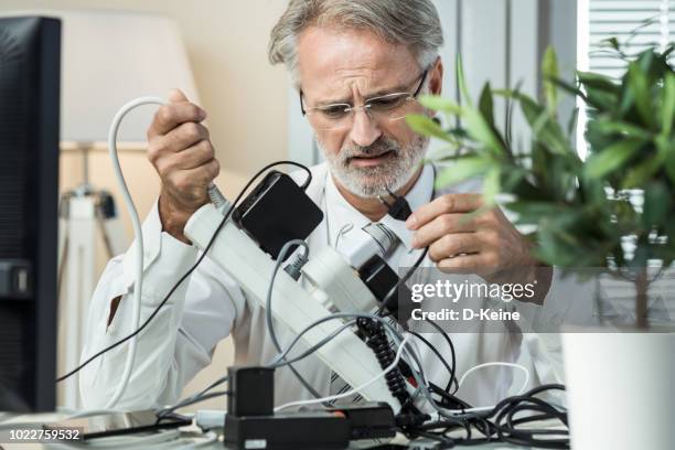 overcrowded power board - bustling office stock pictures, royalty-free photos & images