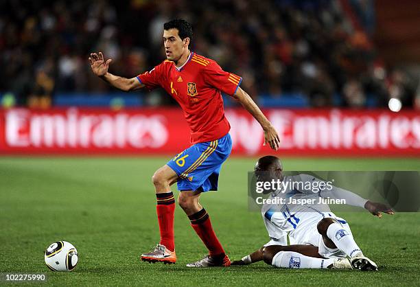 Sergio Busquets of Spain evades the challenge from David Suazo of Honduras during the 2010 FIFA World Cup South Africa Group H match between Spain...