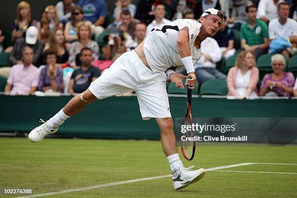 Maximo Gonzalez of Argentina serves during his first round match against Lleyton Hewitt of Australia on Day One of the Wimbledon Lawn Tennis...