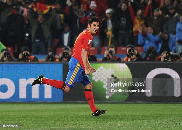 David Villa of Spain celebrates scoring the opening goal during the 2010 FIFA World Cup South Africa Group H match between Spain and Honduras at...