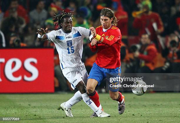 Walter Martinez of Honduras and Sergio Ramos of Spain battle for the ball during the 2010 FIFA World Cup South Africa Group H match between Spain and...