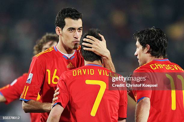 Sergio Busquets of Spain kisses David Villa as they celebrate Villa scoring his second goal during the 2010 FIFA World Cup South Africa Group H match...