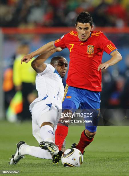 Wilson Palacios of Honduras tackles David Villa of Spain during the 2010 FIFA World Cup South Africa Group H match between Spain and Honduras at...