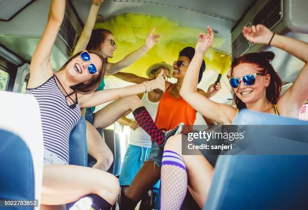 group of teenagers celebrating on the bus - party bus stock pictures, royalty-free photos & images