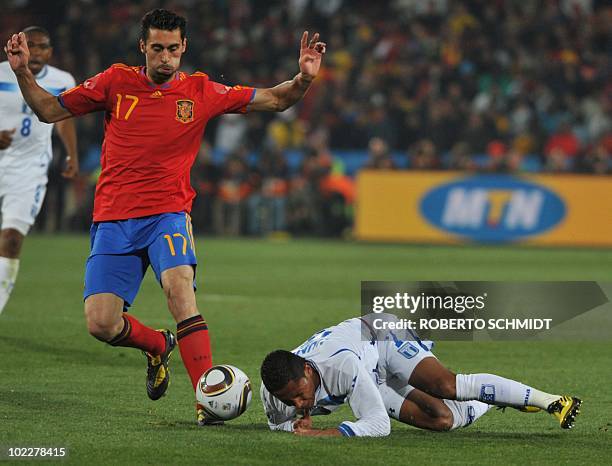 Spain's defender Alvaro Arbeloa tackles Honduras' midfielder Ramon Nunez during the 2010 World Cup group H first round football match between Spain...