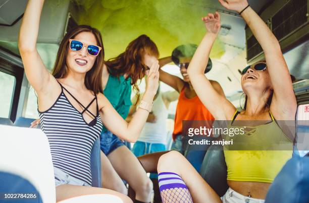 group of teenagers celebrating on the bus - party bus stock pictures, royalty-free photos & images