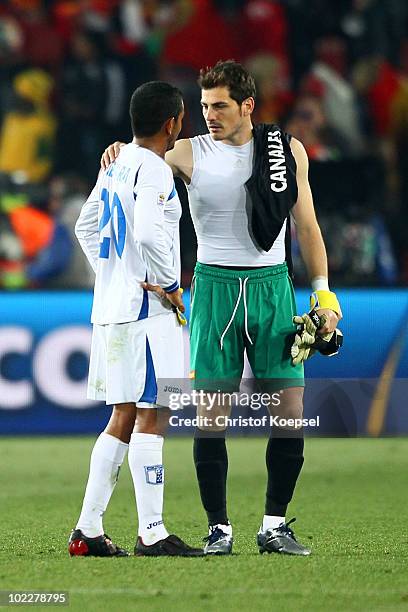 Iker Casillas of Spain consoles Amado Guevara of Honduras after the 2010 FIFA World Cup South Africa Group H match between Spain and Honduras at...