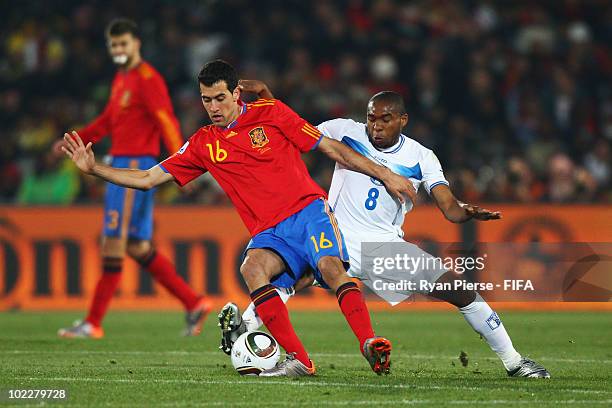 Sergio Busquets of Spain is challenged by Wilson Palacios of Honduras during the 2010 FIFA World Cup South Africa Group H match between Spain and...
