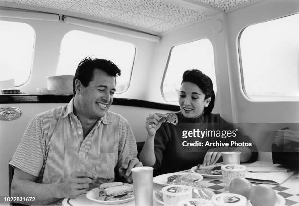 Actors Rock Hudson and Linda Cristal on board a yacht, 18th February 1960.