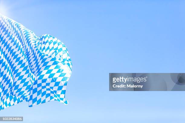 bavarian flag against clear blue sky during sunny day. germany, bavaria, munich, beer fest - oktoberfest 2018 stock pictures, royalty-free photos & images