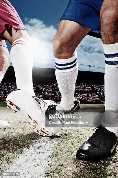 soccer players competing for soccer ball - defence player stock pictures, royalty-free photos & images