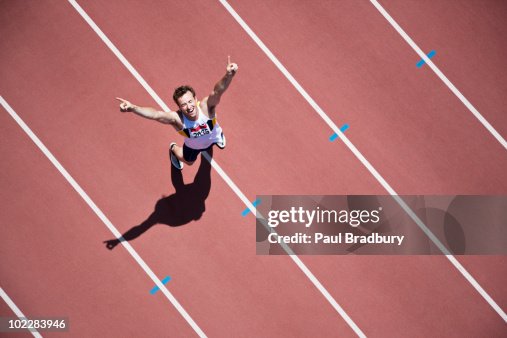 Runner cheering on track Runner cheering on track
