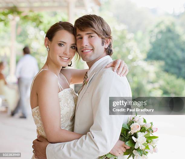 bride and groom hugging - married photos stock pictures, royalty-free photos & images