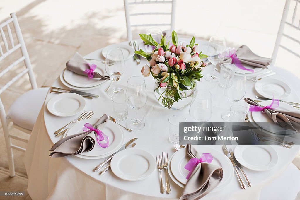 Place setting and centerpiece at wedding reception