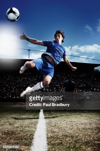 Soccer Player Kicking Soccer Ball High-Res Stock Photo - Getty Images