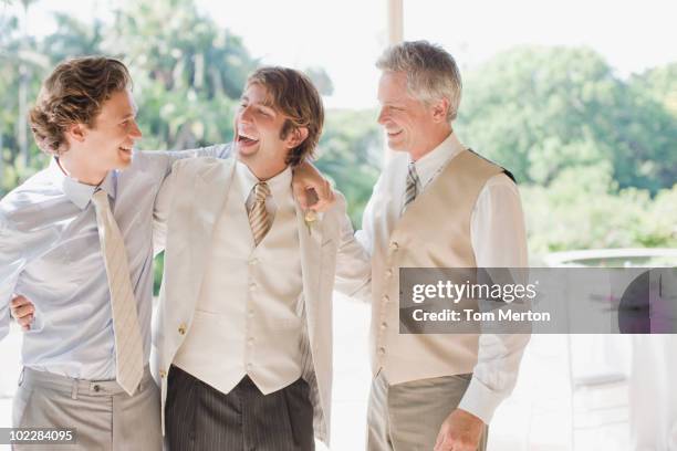 groom and groomsmen hugging - best man stock pictures, royalty-free photos & images