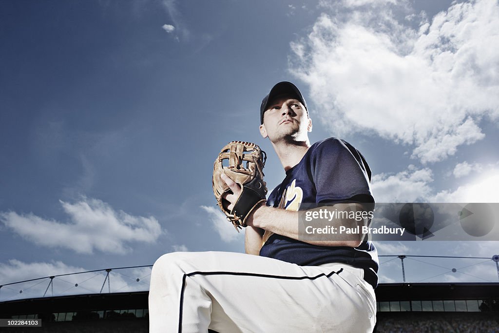 Baseball pitcher preparing to throw ball