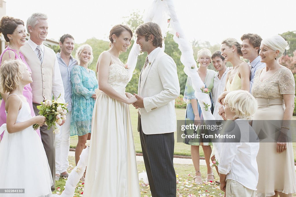 Guests watching bride and groom