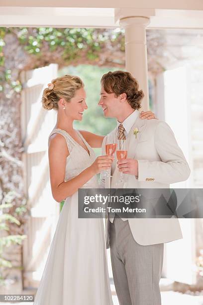 bride and groom drinking champagne - man tuxedo profile stock pictures, royalty-free photos & images