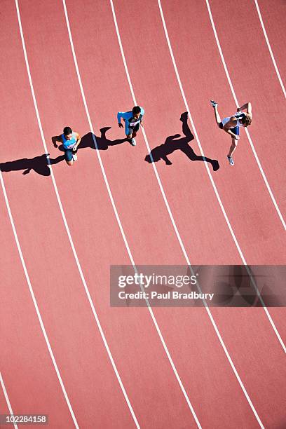 runners competing on track - sports track from above stock pictures, royalty-free photos & images