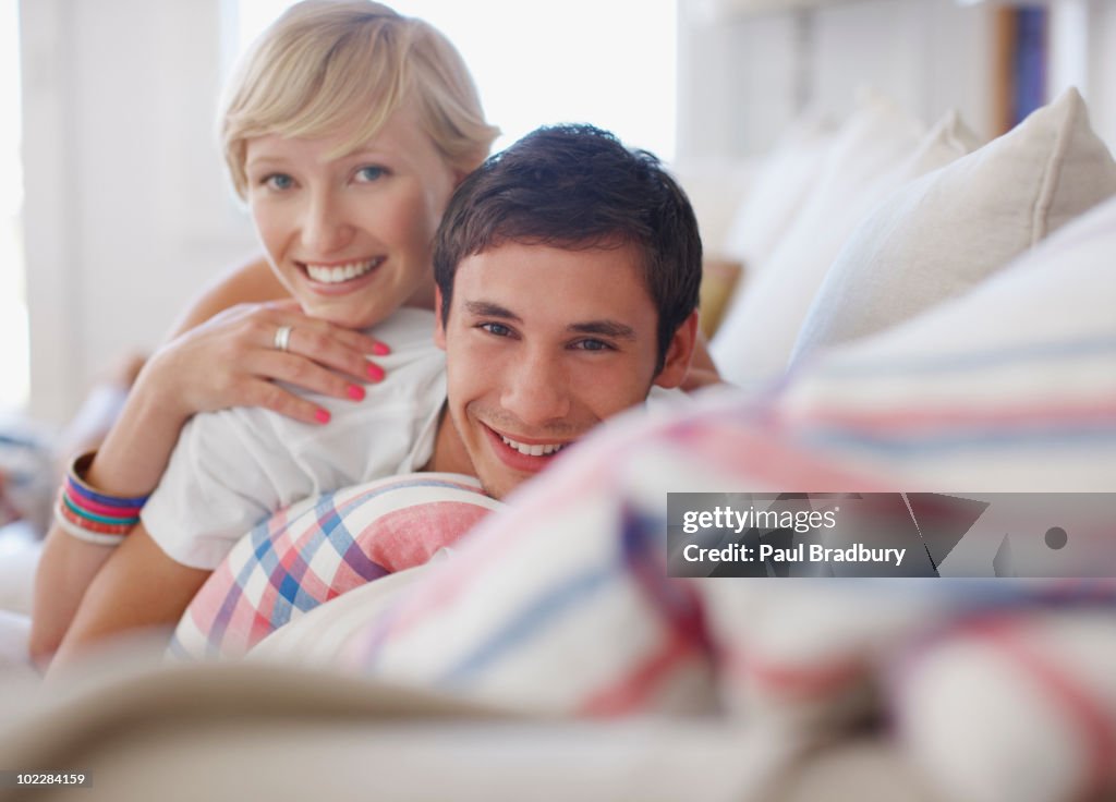 Couple laying on sofa