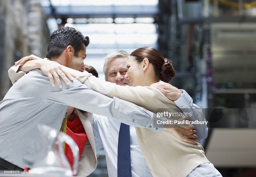 Business People Hugging High-Res Stock Photo - Getty Images