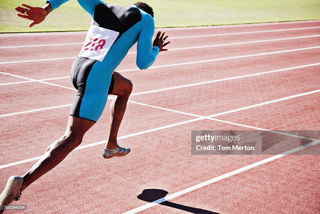 Runner sprinting on track