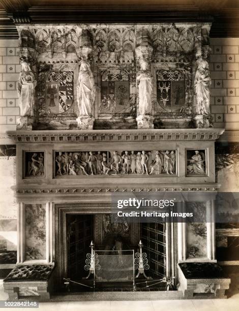 Fireplace and ornate mantlepiece in the saloon at Eaton Hall, Eccleston, Cheshire, 1887. Eaton Hall was remodelled in the Gothic style in 1870-1882...