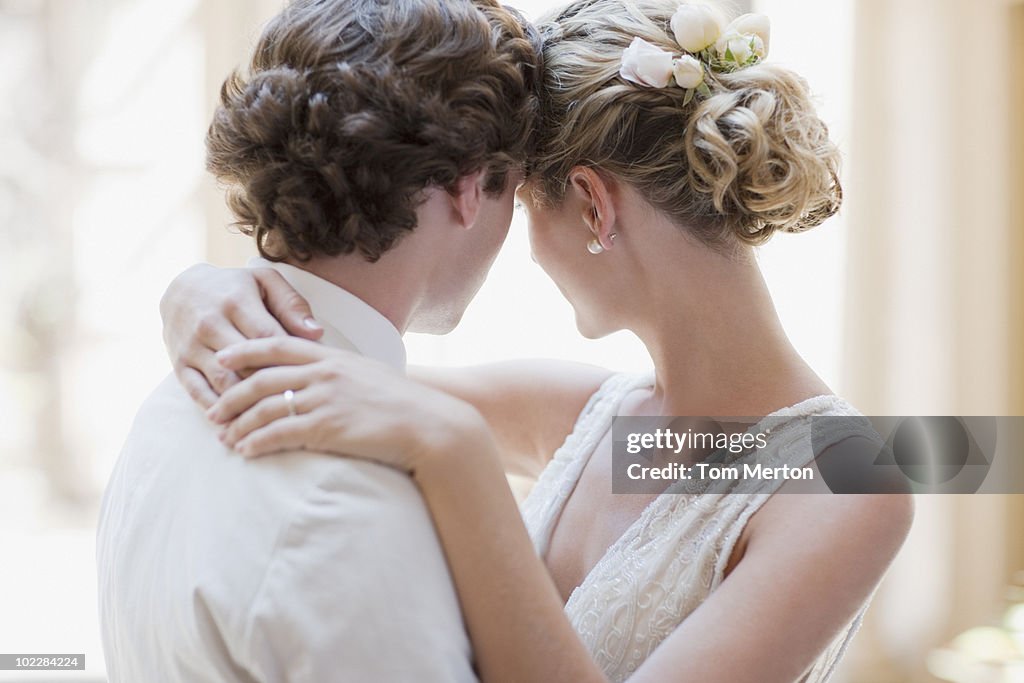 Bride and groom hugging