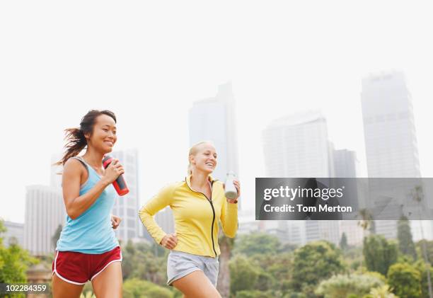 friends running in urban park - sydney people stock pictures, royalty-free photos & images