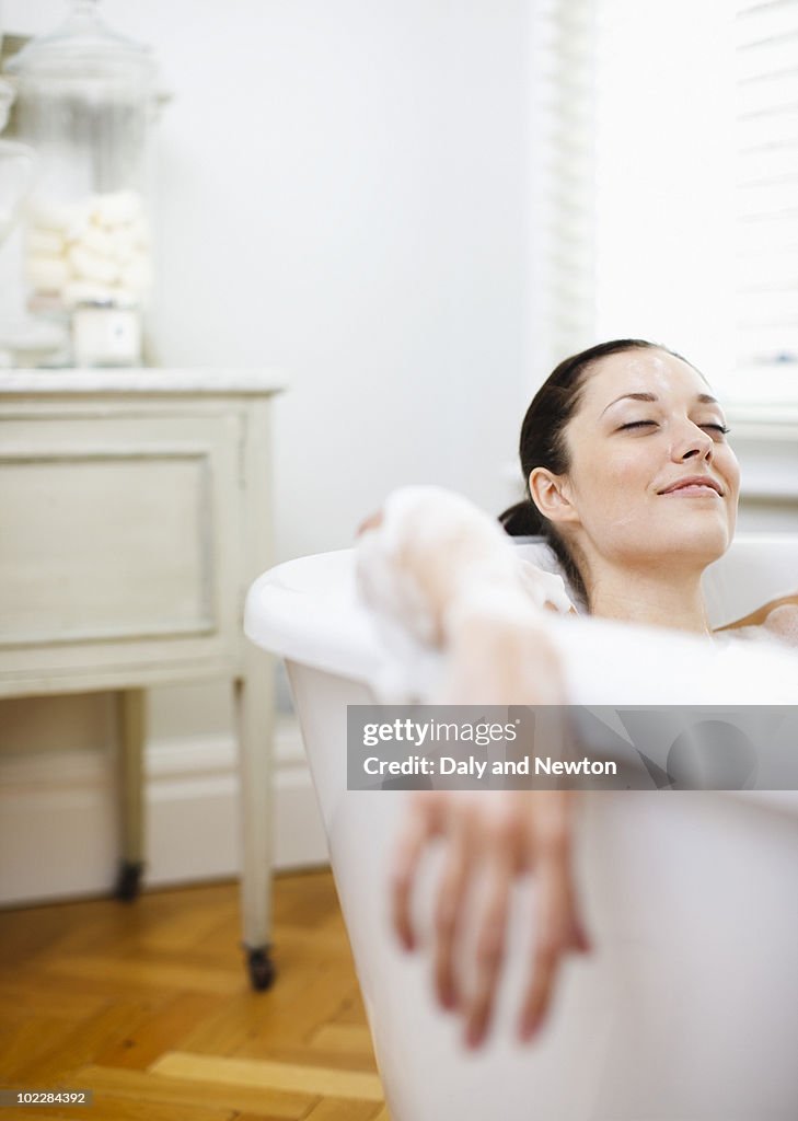 Woman enjoying bubble bath