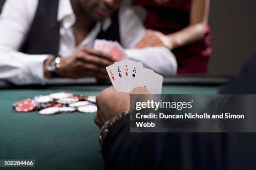 Man with four aces in casino Man with four aces in casino