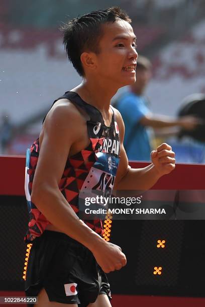 Japan's Hiroto Inoue celebrates winning the men's marathon athletics event during the 2018 Asian Games in Jakarta on August 25, 2018.