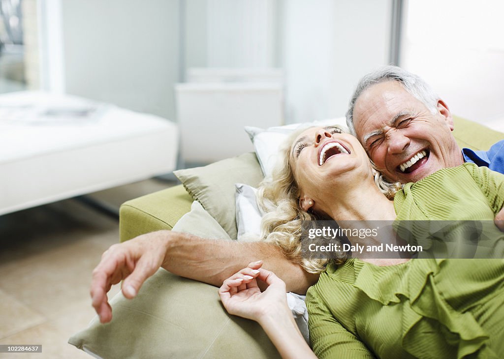 Couple laying on sofa together