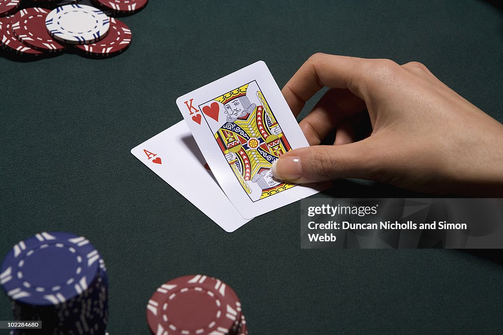 Woman playing blackjack in casino