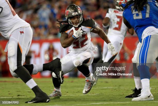 Jacquizz Rodgers of the Tampa Bay Buccaneers rushes during a preseason game against the Detroit Lions at Raymond James Stadium on August 24, 2018 in...