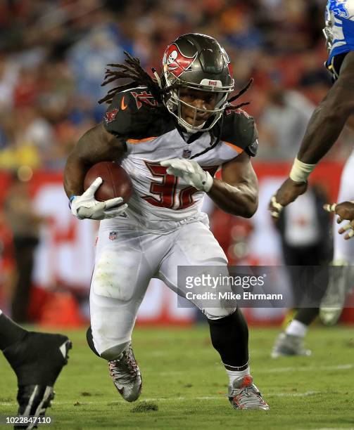 Jacquizz Rodgers of the Tampa Bay Buccaneers rushes during a preseason game against the Detroit Lions at Raymond James Stadium on August 24, 2018 in...