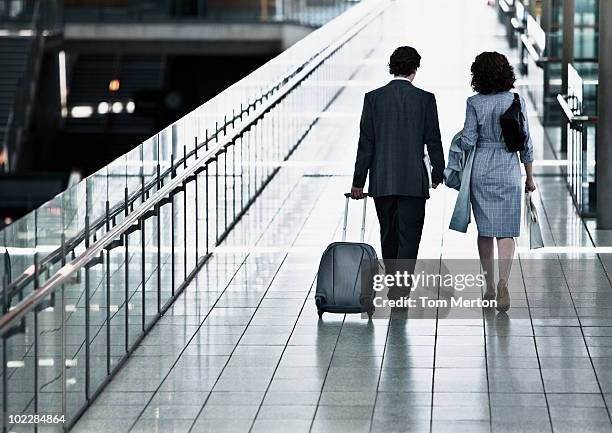 business people traveling together - business woman suitcase stock pictures, royalty-free photos & images